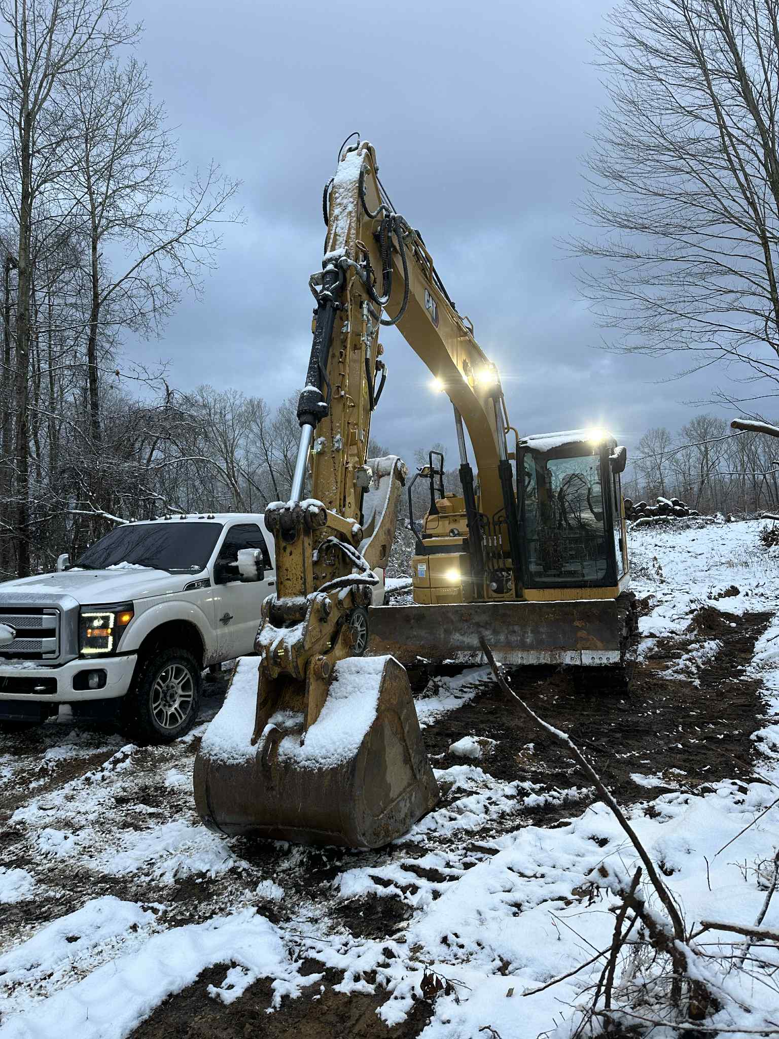 Excavator working in snow